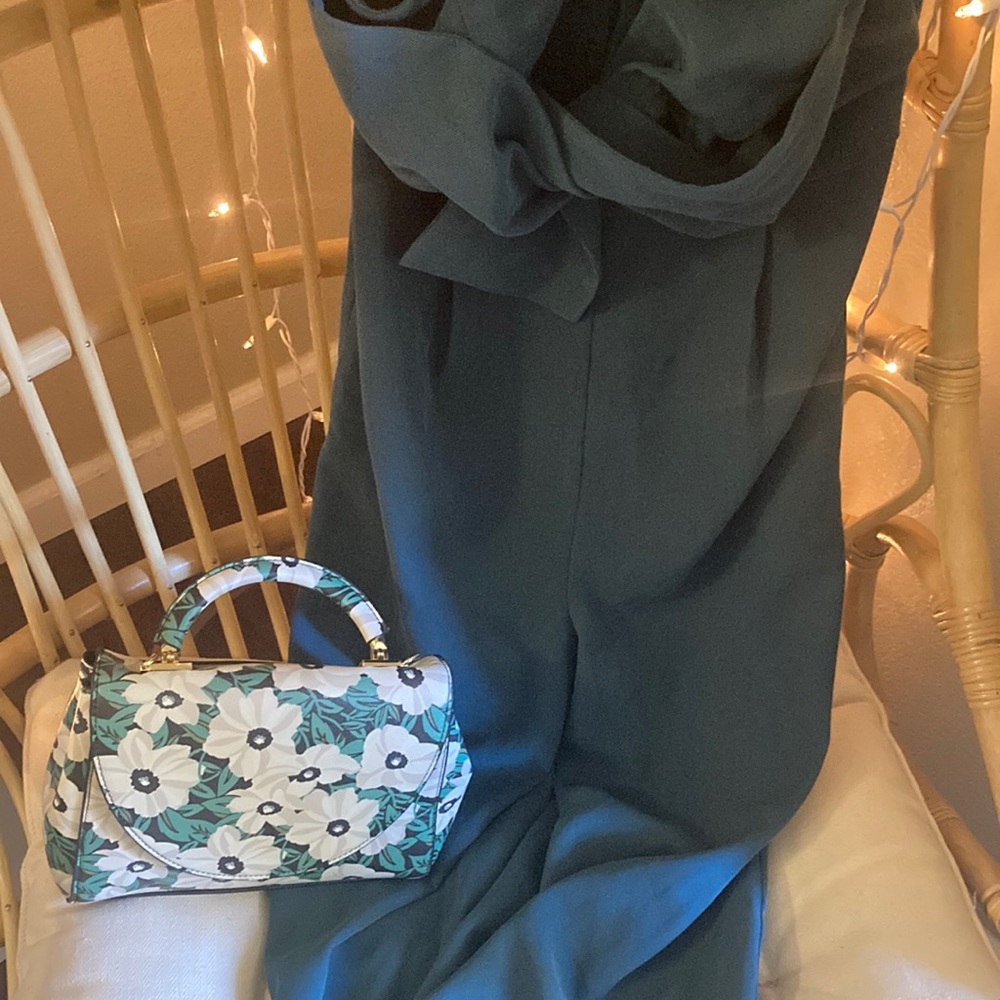 Green jumpsuit that can be styled in many ways. Turtle neck underneath or heels!